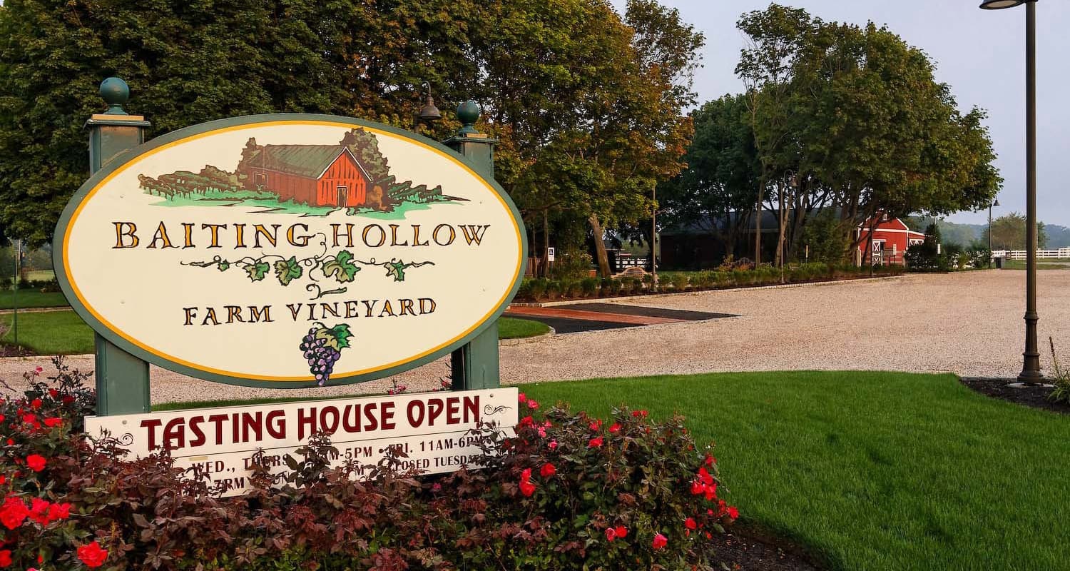 Entrance sign and driveway at Baiting Hollow Farm Vineyard