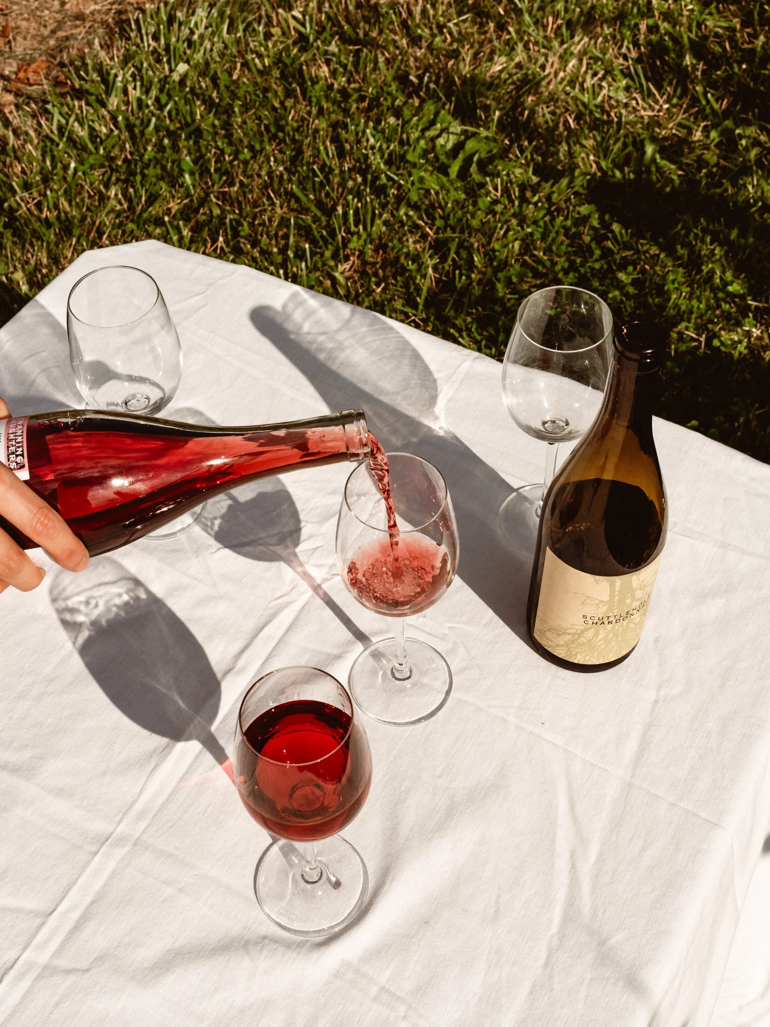 Red wine poured at an outdoor table at Channing Daughters in Bridgehampton